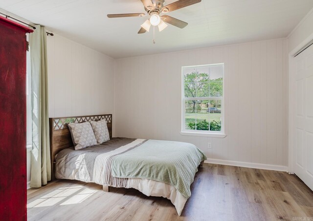 8033 Renee Cir, Benton, AR 72019 - bedroom with wood finished floors, ceiling fan, and baseboards