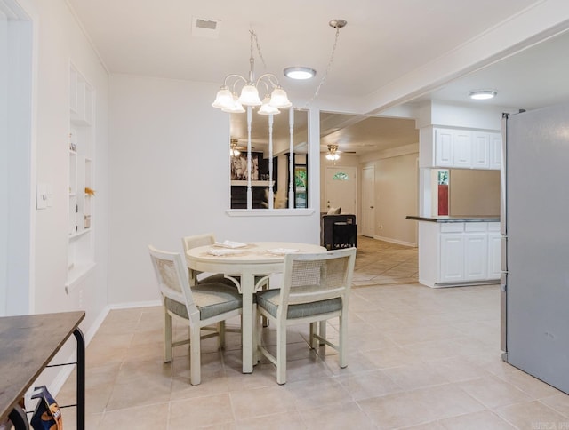 8033 Renee Cir, Benton, AR 72019 - dining area featuring light tile patterned floors, visible vents, baseboards, and ceiling fan with notable chandelier