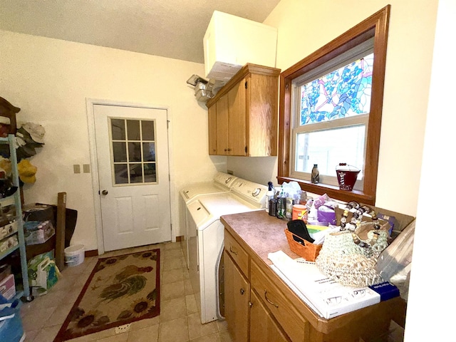 2157 Pleasant Grove Rd, Wideman, AR 72585 - clothes washing area with light tile patterned floors, washer and clothes dryer, and cabinet space