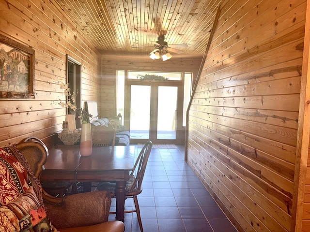 2157 Pleasant Grove Rd, Wideman, AR 72585 - dining space featuring wooden walls, wooden ceiling, ceiling fan, and dark tile patterned flooring