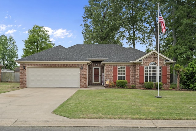 307 Dakota Dr, Cabot, AR 72023 - single story home with brick siding, a shingled roof, a garage, a front yard, and concrete driveway