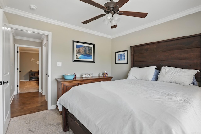 bedroom with crown molding, a ceiling fan, carpet, and baseboards