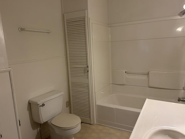 full bathroom with toilet and a sink