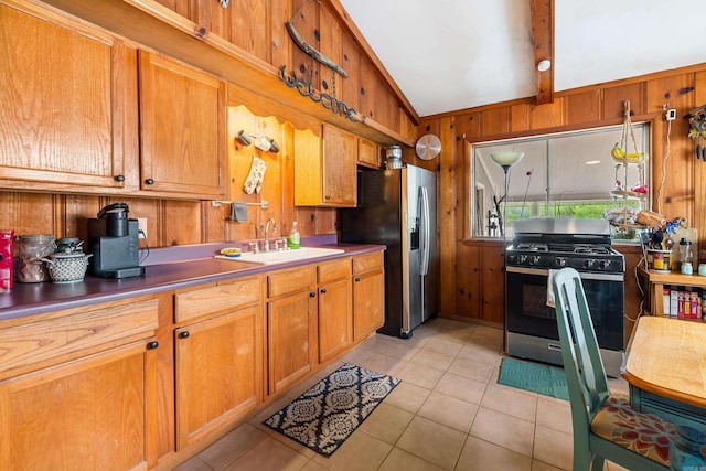 138 Ridge Rd, Houston, AR 72070 - kitchen featuring a sink, stainless steel appliances, light tile patterned floors, vaulted ceiling with beams, and wood walls