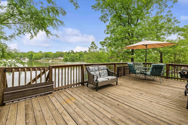 138 Ridge Rd, Houston, AR 72070 - wooden terrace with outdoor dining area and a water view