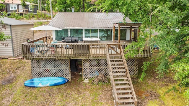 138 Ridge Rd, Houston, AR 72070 - back of property with outdoor dining space, a deck, metal roof, and stairs