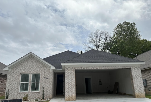 3516 Logan Rdg, Bryant, AR 72022 - ranch-style home with concrete driveway, a shingled roof, an attached garage, and brick siding