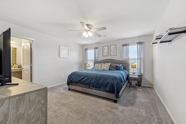 bedroom with baseboards, ceiling fan, a textured ceiling, and carpet