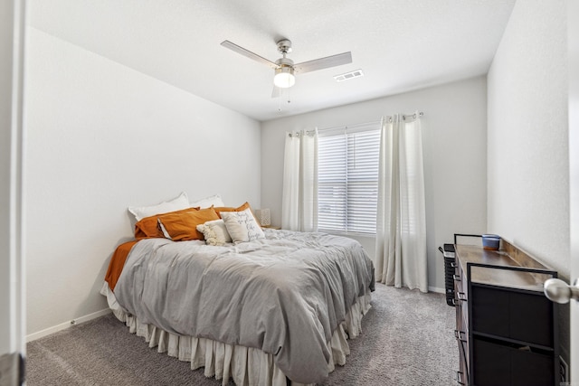 bedroom with baseboards, visible vents, ceiling fan, and light colored carpet