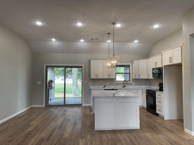 2106 N 8 1/2 St, Paragould, AR 72450 - kitchen with dark wood finished floors, white cabinets, black appliances, and lofted ceiling