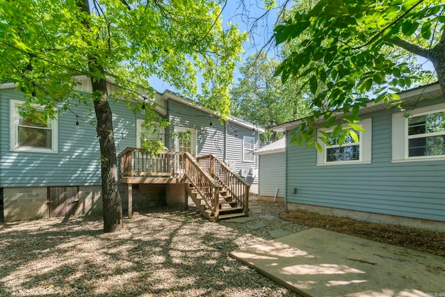 6123 Longwood, Little Rock, AR 72207 - back of house with a deck, stairway, and a patio area