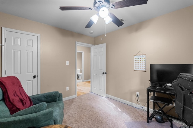 interior space featuring baseboards, a ceiling fan, and carpet flooring