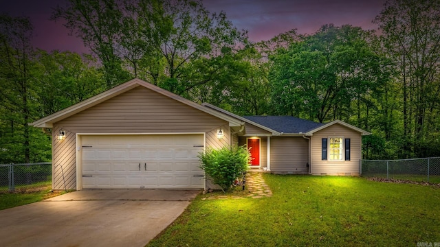 ranch-style home featuring driveway, a yard, an attached garage, and fence