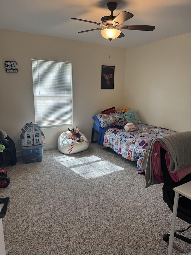 bedroom with ceiling fan and carpet flooring