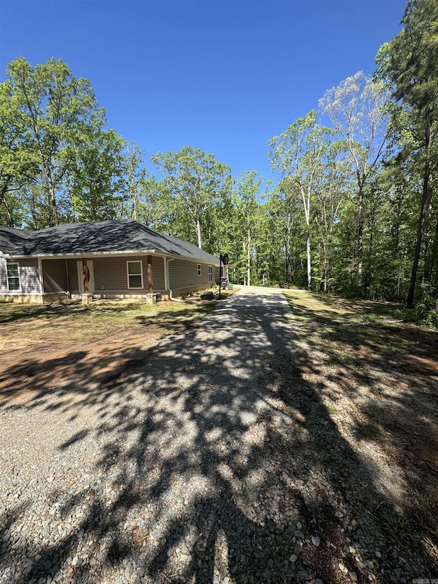 view of side of home with driveway