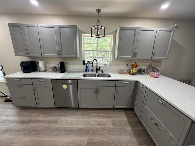 kitchen featuring a sink, gray cabinetry, and dishwasher
