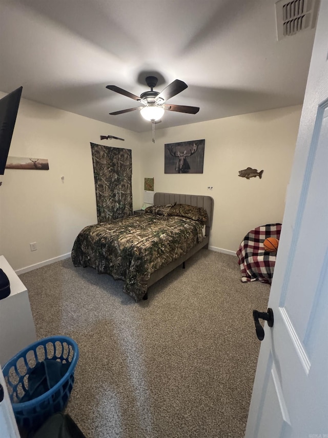 carpeted bedroom featuring visible vents, ceiling fan, and baseboards
