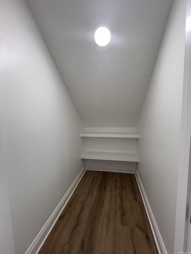4406 Magee Dr, Texarkana, AR 71854 - interior space featuring dark wood-style floors and vaulted ceiling