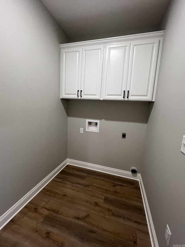 4406 Magee Dr, Texarkana, AR 71854 - clothes washing area featuring dark wood finished floors, cabinet space, hookup for an electric dryer, washer hookup, and baseboards