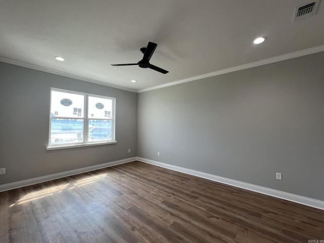 4406 Magee Dr, Texarkana, AR 71854 - spare room featuring dark wood-type flooring, visible vents, a ceiling fan, and baseboards