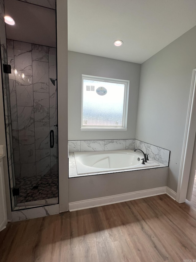 4406 Magee Dr, Texarkana, AR 71854 - full bath with recessed lighting, wood finished floors, a shower stall, baseboards, and a garden tub
