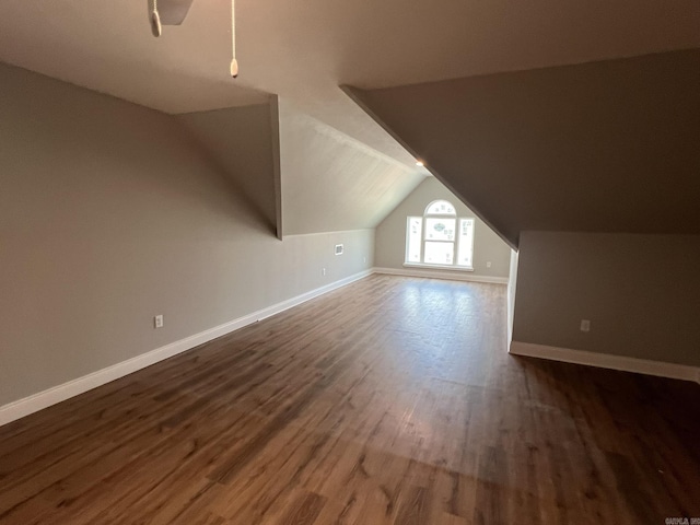4406 Magee Dr, Texarkana, AR 71854 - additional living space with dark wood-style flooring, vaulted ceiling, and baseboards