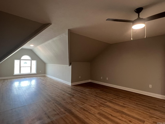 4406 Magee Dr, Texarkana, AR 71854 - bonus room with dark wood-style flooring, ceiling fan, vaulted ceiling, and baseboards