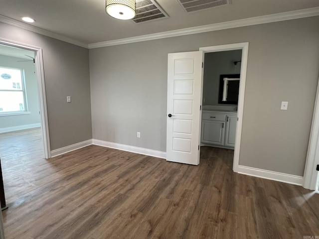 4406 Magee Dr, Texarkana, AR 71854 - interior space with visible vents, ornamental molding, dark wood finished floors, and baseboards