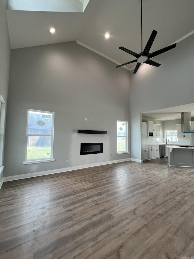 4406 Magee Dr, Texarkana, AR 71854 - unfurnished living room with recessed lighting, a ceiling fan, high vaulted ceiling, and baseboards