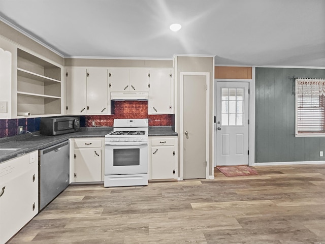 kitchen featuring under cabinet range hood, open shelves, ornamental molding, dark countertops, and appliances with stainless steel finishes