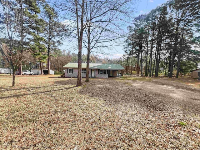 exterior space with dirt driveway