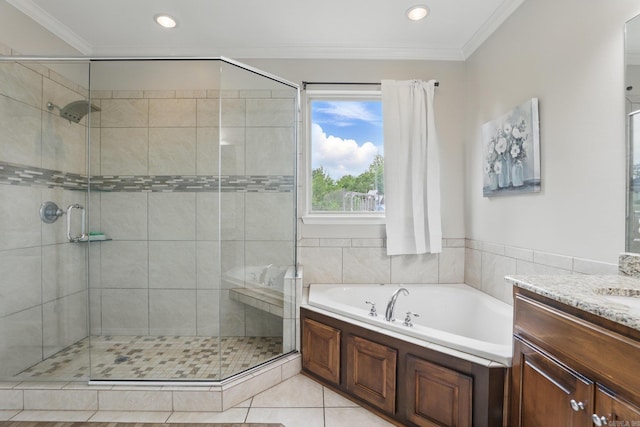 bathroom with a garden tub, a shower stall, ornamental molding, and vanity