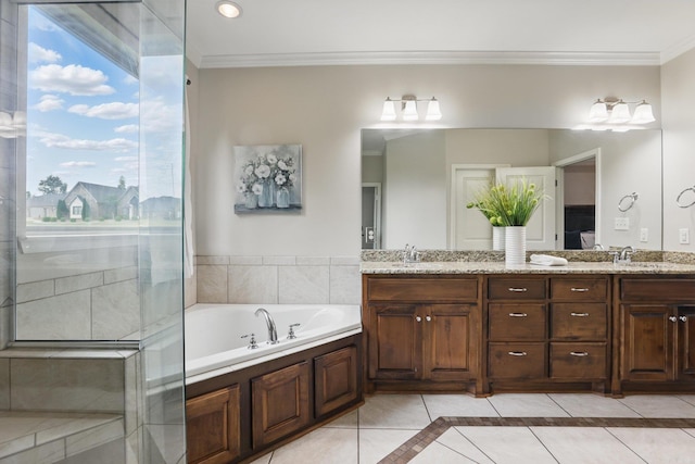 bathroom featuring ornamental molding, a bath, tile patterned flooring, and double vanity