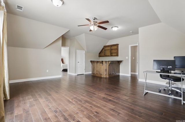 office with ceiling fan, visible vents, baseboards, vaulted ceiling, and dark wood finished floors