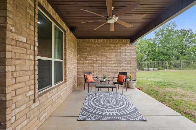 view of patio featuring ceiling fan and fence