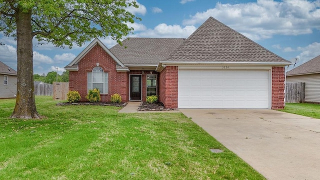 single story home with a garage, brick siding, a front yard, and driveway
