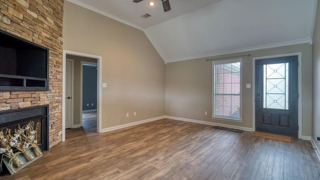 unfurnished living room featuring wood finished floors, baseboards, visible vents, a ceiling fan, and lofted ceiling