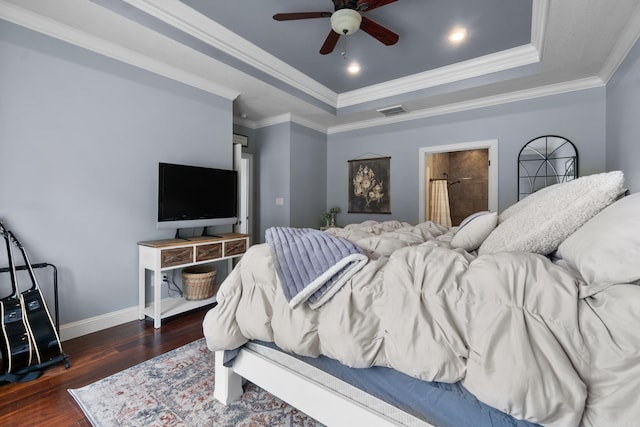 bedroom with a raised ceiling, visible vents, baseboards, recessed lighting, and wood finished floors