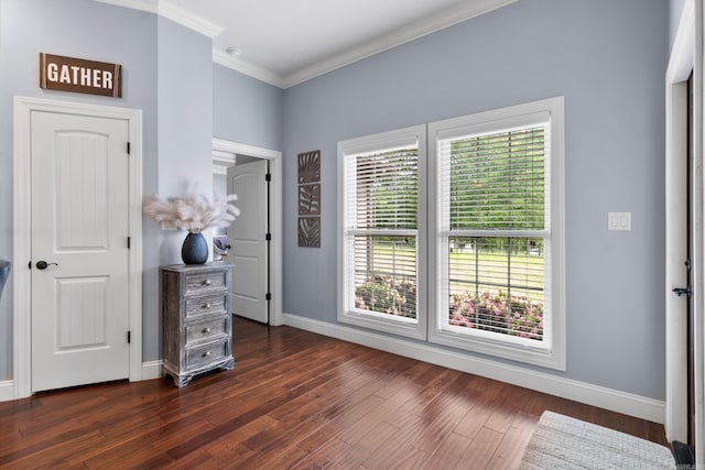 bedroom with crown molding, dark wood-type flooring, and baseboards