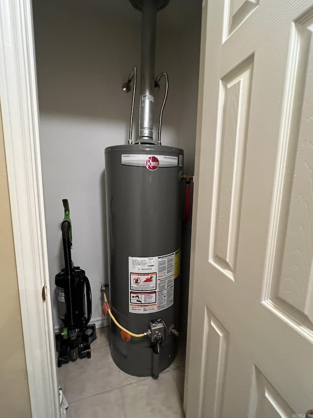 utility room featuring water heater