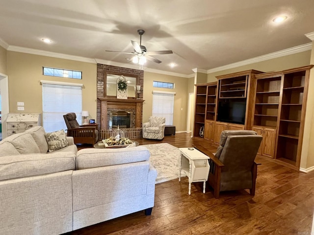 living room with a brick fireplace, a ceiling fan, and dark wood finished floors