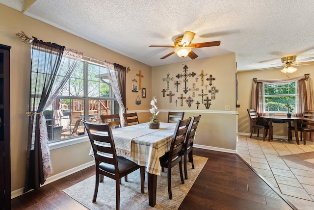 dining area featuring a textured ceiling, ceiling fan, and plenty of natural light