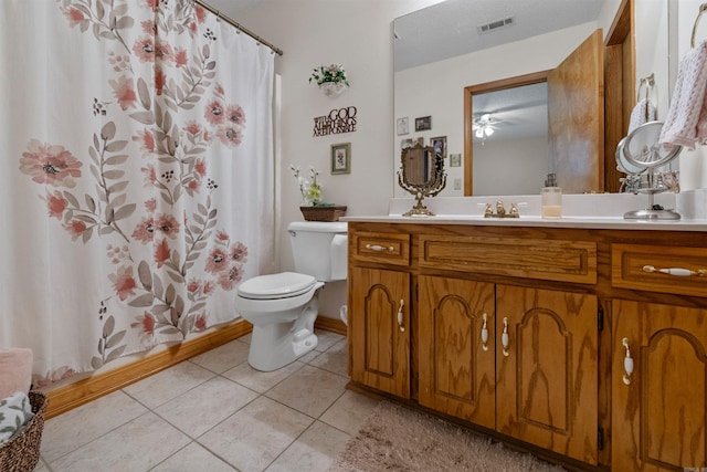 full bath featuring a shower with curtain, visible vents, toilet, vanity, and tile patterned flooring