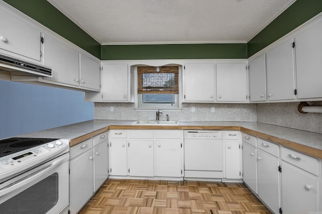kitchen with tasteful backsplash, white appliances, under cabinet range hood, a sink, and white cabinetry