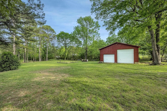 view of yard with an outbuilding and a garage