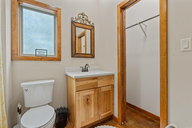 539 Burchwood Bay Rd, Hot Springs, AR 71913 - bathroom with baseboards, toilet, and vanity