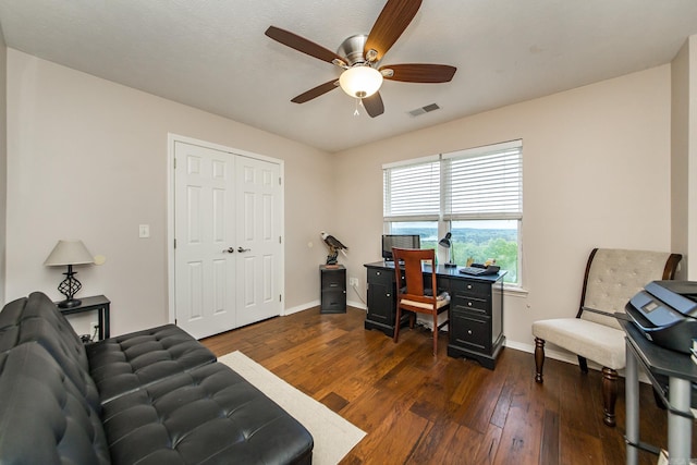 home office with wood-type flooring, ceiling fan, baseboards, and visible vents