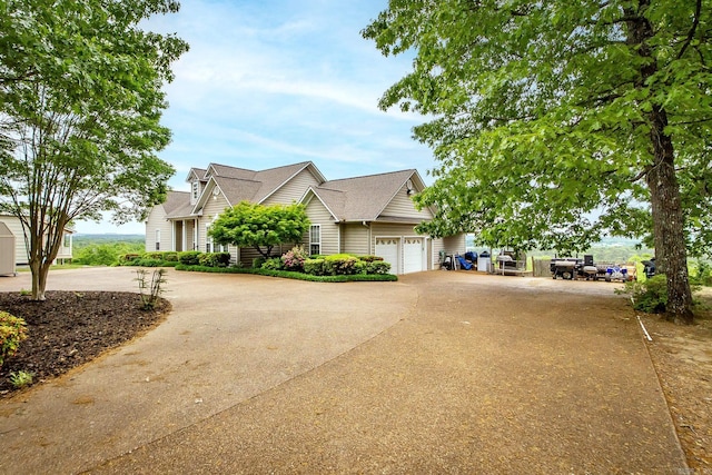 view of front facade featuring concrete driveway and a garage