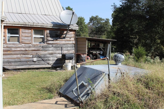 exterior space featuring a standing seam roof and metal roof