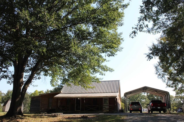 exterior space featuring a carport and metal roof